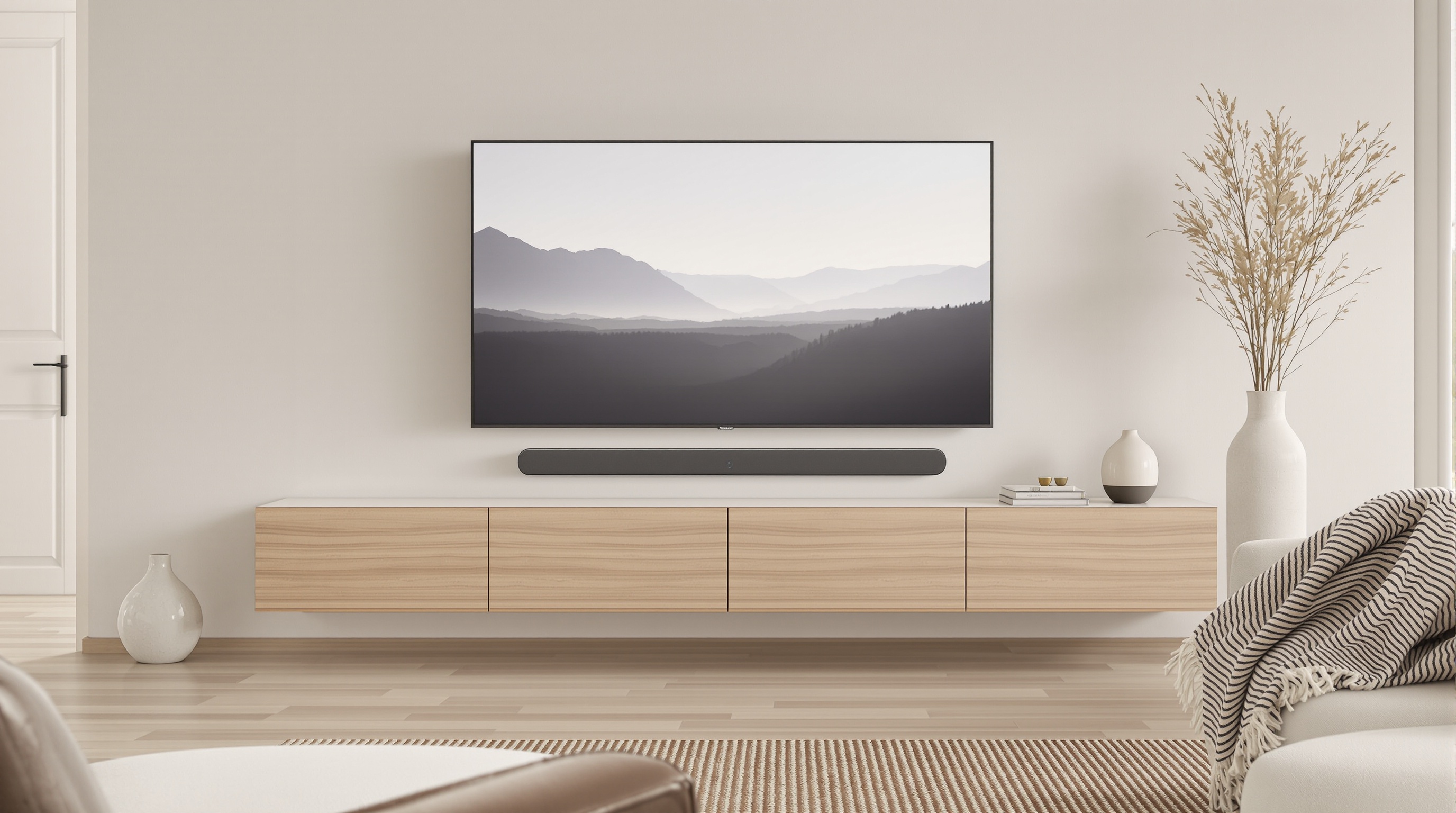Barre de son Beosound Theatre installée dans un salon scandinave luxueux.